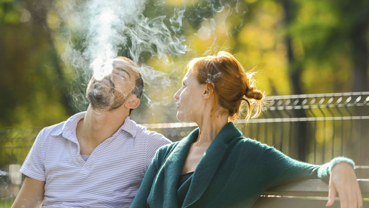 Man and woman smoking weed.