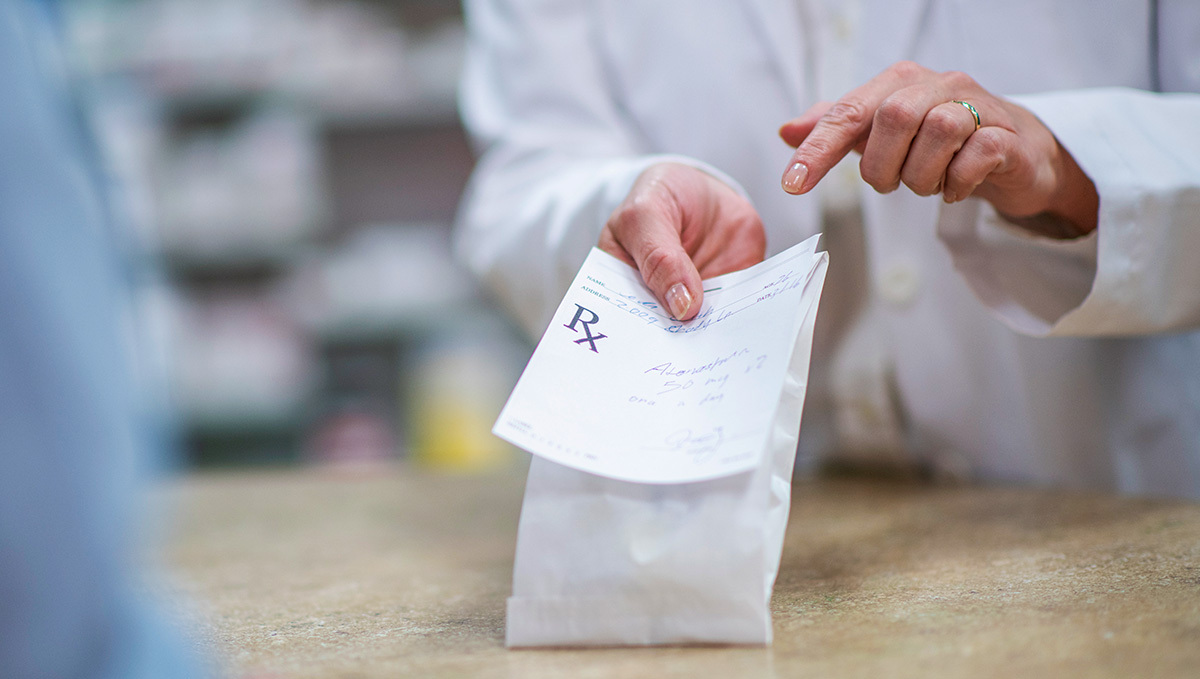 Legal Weed Makes Prescription Drugs Use Go Down, Study Finds: A woman doctor holding a filled prescription Legal Weed Makes Prescription Drugs Use Go Down, Study Finds: A woman doctor holding a filled prescription